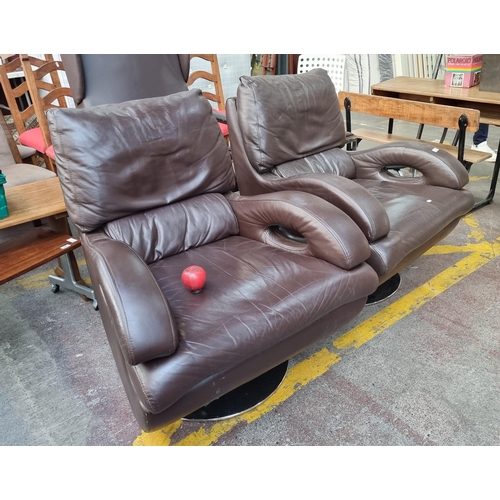 345 - Two stunning brown leather mid century swivel base armchairs. Extremely comfortable and in excellent... 