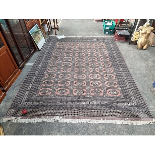 353 - Star Lot : A gorgeous large hand knotted Buchara wool and cotton Persian rug made in Pakistan. In a ... 