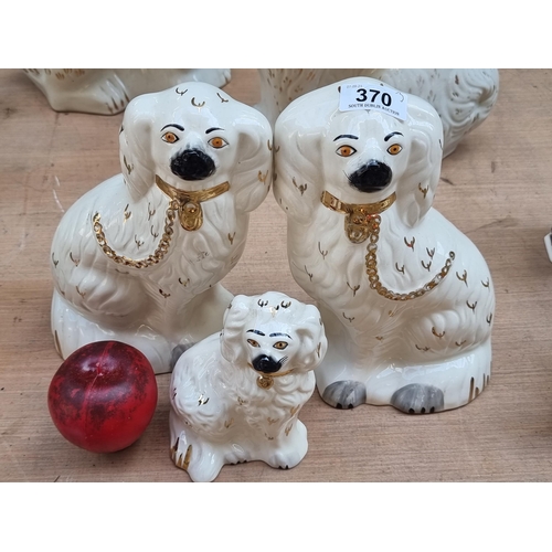 370 - Three vintage Staffordshire style dogs including a pair from Beswick and another single example from... 