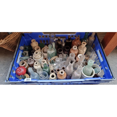 383 - Crate containing approx. 70 vintage glass and ceramic bottles and jars. Unchecked for gems .