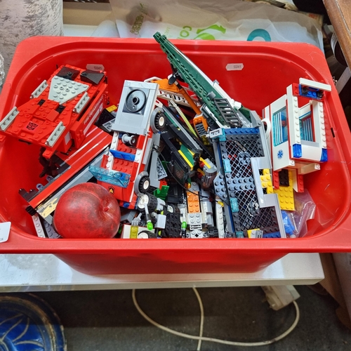 387 - A box containing Lego parts including vehicle elements.