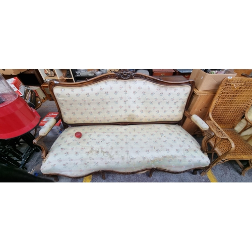 396 - Star Lot : A horse hair original Victorian three-seater sofa with intricate carved wooden detailing,... 