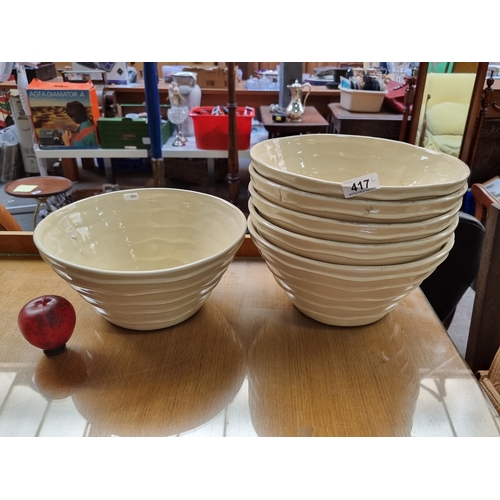 417 - Six very large glazed ceramic bowls with cream wave pattern. Original price stickers of €23 each.