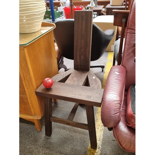 422 - A three legged Irish Tuam / Sligo chair in stained teak wood. Simple straight back rest also reminis... 