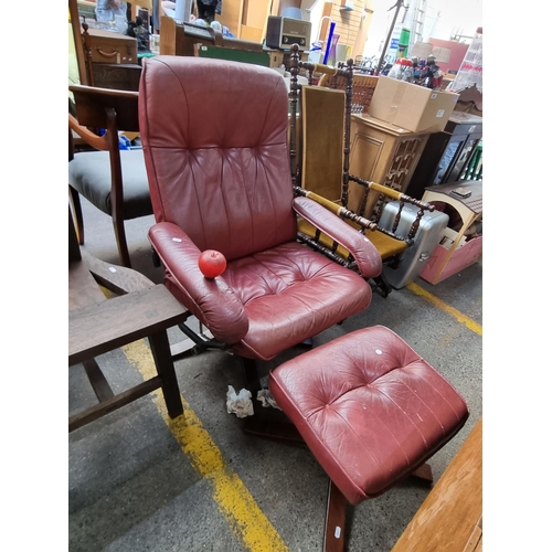 423 - Star Lot A vintage Mid Century genuine leather Danish reclining and swivel armchair and foot stool. ... 