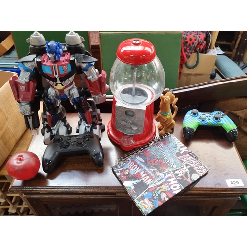 425 - A mix lot of six items including a gum ball machine, a transformer, two Geoteck controllers and an A... 