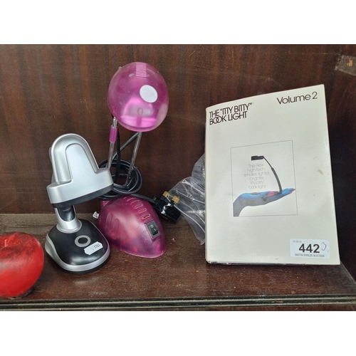 442 - Three lights / lamps. Includes an 'Itty Bitty' branded book light with plug and optional battery pac... 