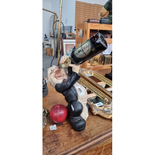 455 - 'The drunken Butler' collectable wine / beer bottle holder. Featuring a drunken butler enthusiastica... 