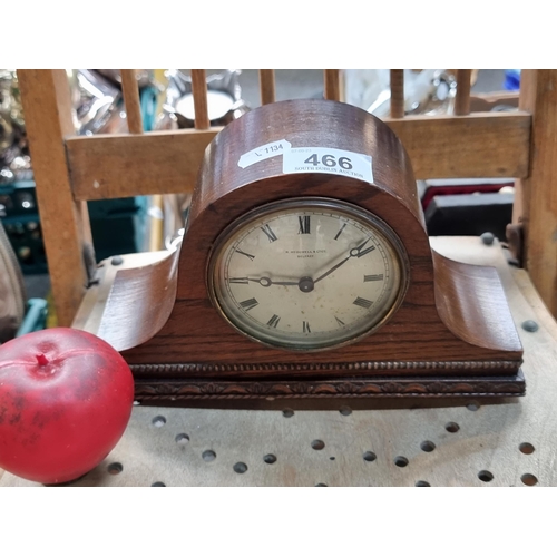 466 - A vintage mantel clock made by R. McDowell Belfast featuring Roman numerals to face, held in a Napol... 