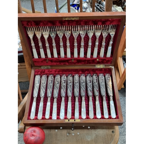 474 - A lovely vintage cutlery canteen holding silver plated fish knives and forks set with sterling silve... 