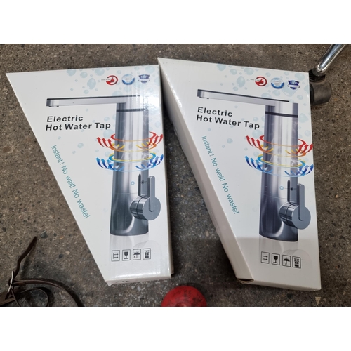 477 - Two brand new Electric Hot Water Taps in original packaging.