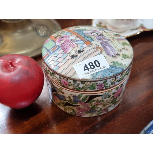 480 - A hand painted porcelain lidded jar featuring Japanese style garden paintings of birds and foliage, ... 