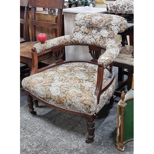 736 - Star Lot : A great example of a Victorian tub chair held on original castors and featuring beautiful... 