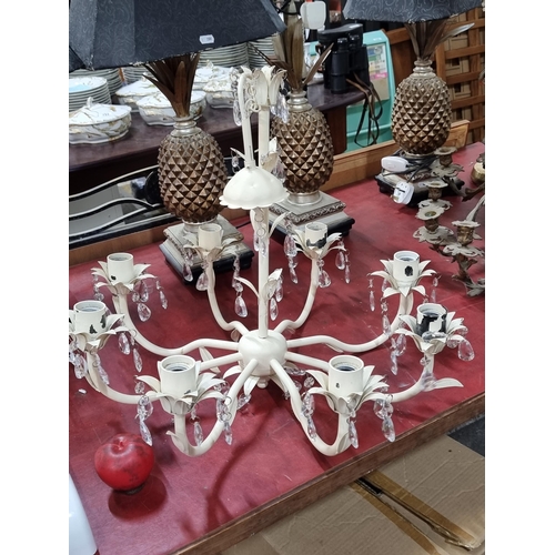 750 - A very pretty eight branch chandelier in an off white finish.