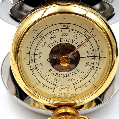 17 - A stylish Dalvey of Scotland barometer, featuring a polished chrome dual toned casing and featuring ... 