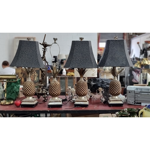 751 - A set of four unusual pineapple shaped table lamps, three with black shades.