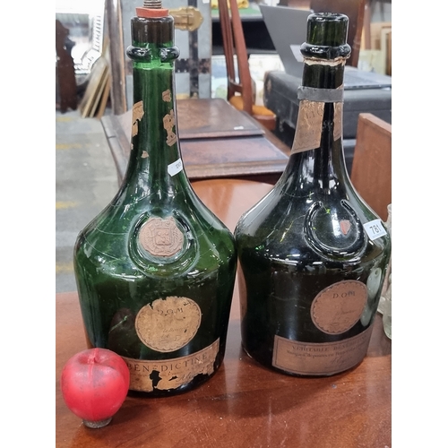 781 - Two fabulous large glass French Bénédictine liqueur bottles.