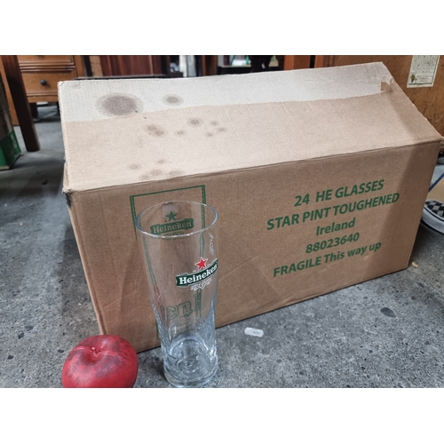 810 - A brand new box of 24 Heineken pub pint glasses.