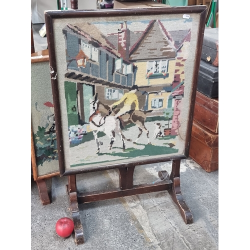 813 - A charming vintage convertible fire screen featuring a hand embroidered village scene to front. Pane... 