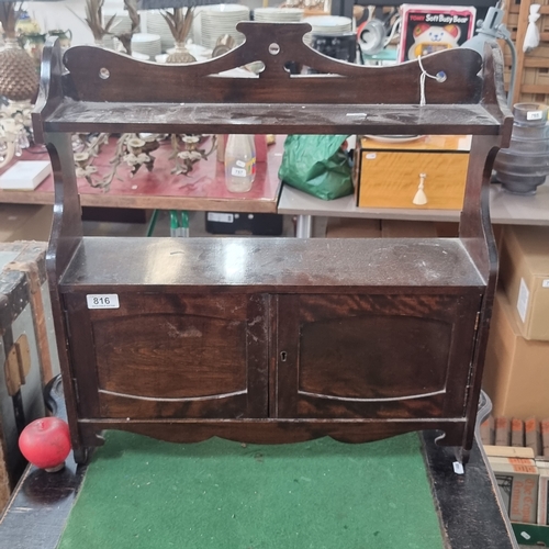 816 - An antique  mahogany storage unit with shelf to top and lockable cupboard to base. Lovely curvilinea... 