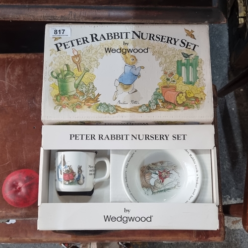 817 - A Peter Rabbit nursery set by Wedgwood, unopened, in original box. Includes mug, plate and cereal bo... 