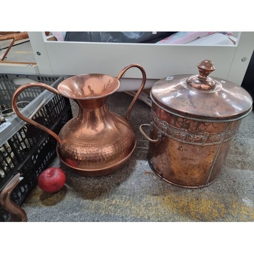 857 - A vintage copper lidded coal pot with removable bucket, along with a large double handled copper vas... 