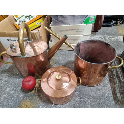 858 - A Portuguese made copper pot, a copper watering can and a large copper sauce pan. All set with brass... 