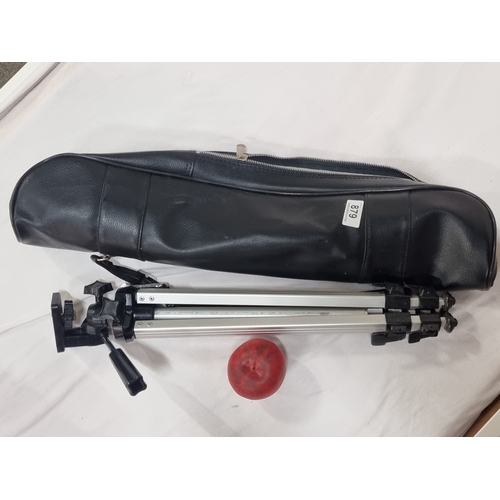 879 - A Revue camera tripod with travel case.