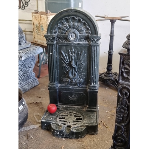 930 - Star lot : A heavy cast metal garden water tap frame with a drip tray to base. featuring a snake and... 