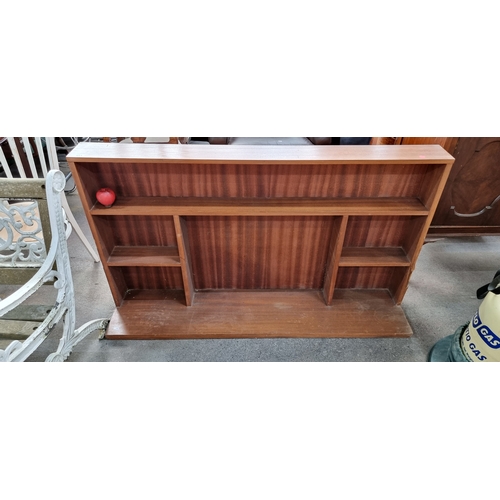 951 - A large Mid Century shelving unit with five compartments and a wide base. H84cm x W145cm x D31cm No ... 