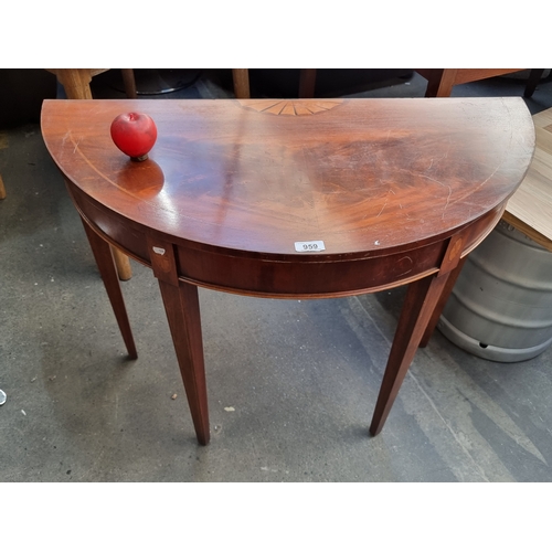 959 - A beautiful Regency style flamed mahogany demilune table featuring sunburst parquetry to top and str... 