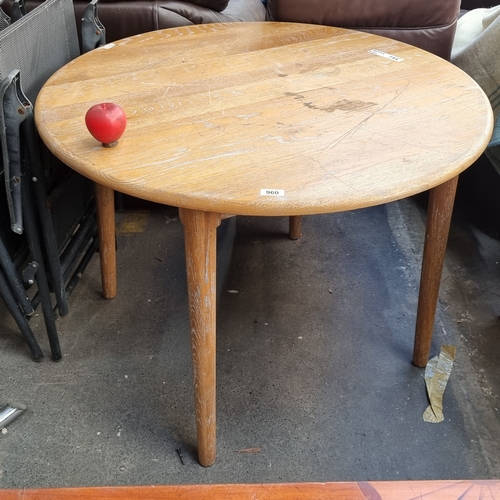 960 - A country style dining table with a round top held on four tapered legs. H75cm x D100cm No reserve €... 