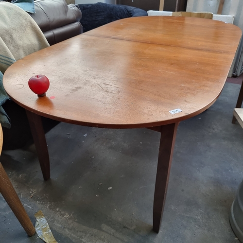 961 - A mid century extendable dining table with rounded edges and tapered legs. H75cm x L178cm (not fully... 