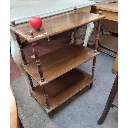 964 - A delightful three tiered shelf unit with turned wood supports. H84cm x W63cm x D34cm No reserve €1 ... 