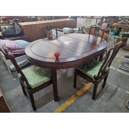 981 - Star Lot: A beautiful Chinese rosewood extendable dining table along with four matching chairs with ... 