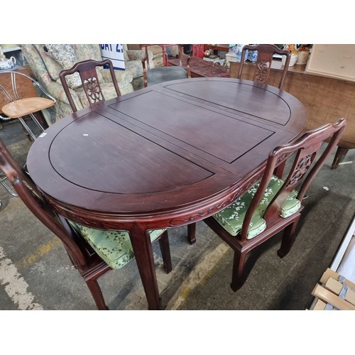 981 - Star Lot: A beautiful Chinese rosewood extendable dining table along with four matching chairs with ... 