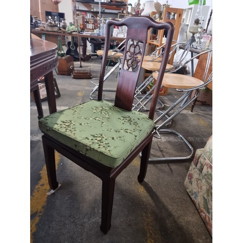 981 - Star Lot: A beautiful Chinese rosewood extendable dining table along with four matching chairs with ... 