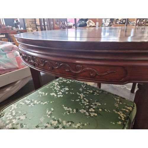 981 - Star Lot: A beautiful Chinese rosewood extendable dining table along with four matching chairs with ... 