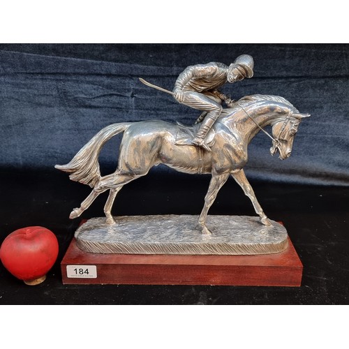 184 - A fabulous heavy silver plated sculpture of a racehorse and jockey. Great movement in this piece. Mo... 