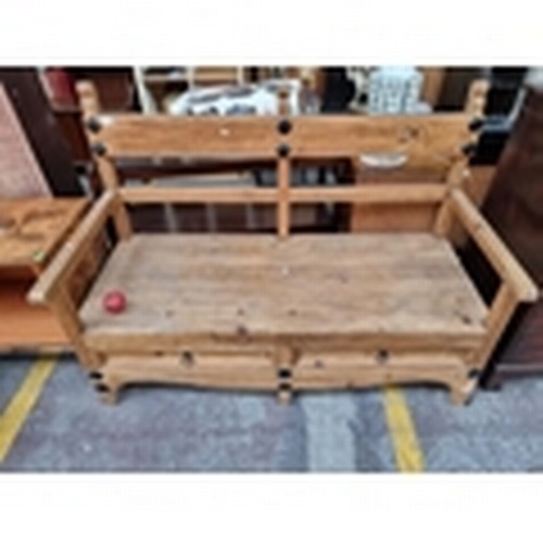 215 - A very handsome, generously proportioned three seater bench, atop two conveniently placed pull out d... 