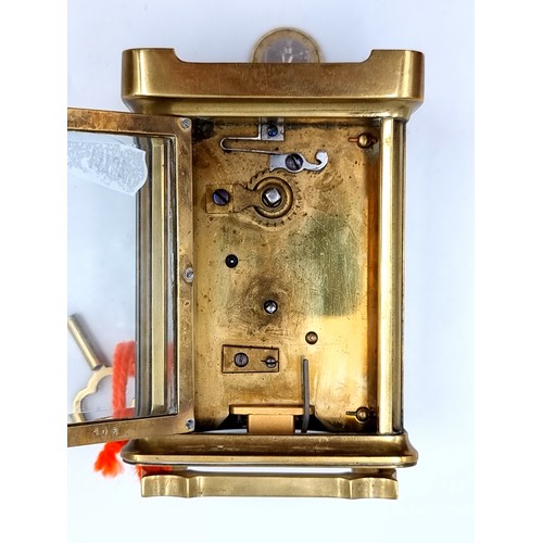 39 - Star Lot: A beautiful mechanical antique brass carriage clock, set with a bright white enamelled dia... 