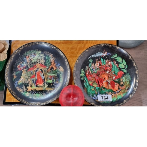 764 - Two pretty hand painted Russian Fairytale  delicate hanging wall plates.  Provenance: from Palladian... 