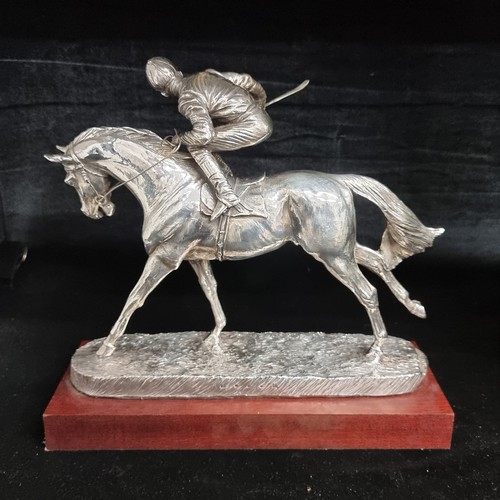 184 - A fabulous heavy silver plated sculpture of a racehorse and jockey. Great movement in this piece. Mo... 