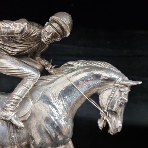 184 - A fabulous heavy silver plated sculpture of a racehorse and jockey. Great movement in this piece. Mo... 