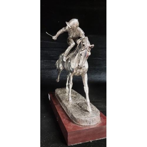 184 - A fabulous heavy silver plated sculpture of a racehorse and jockey. Great movement in this piece. Mo... 