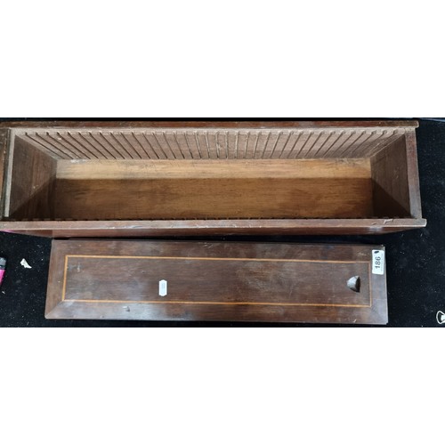 186 - An antique handsome wooden box . Featuring a slide out panel. H58cm