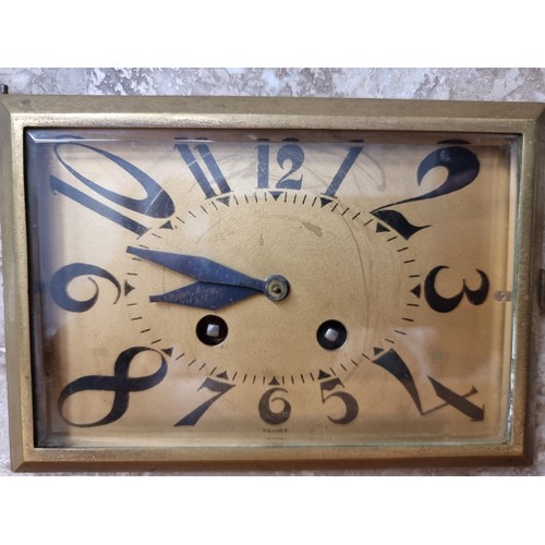 238 - Star Lot : A heavy French made Art Deco clock in marble with two garnitures and abstract numerals to... 