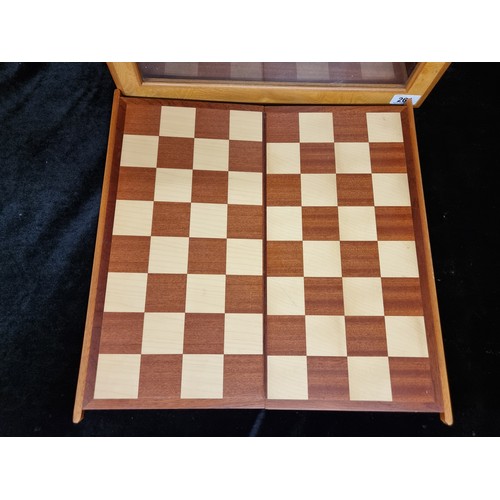 261 - An elegant complete chess and checkers set comprising of a wooden box with a glass panel, a shelf ho... 