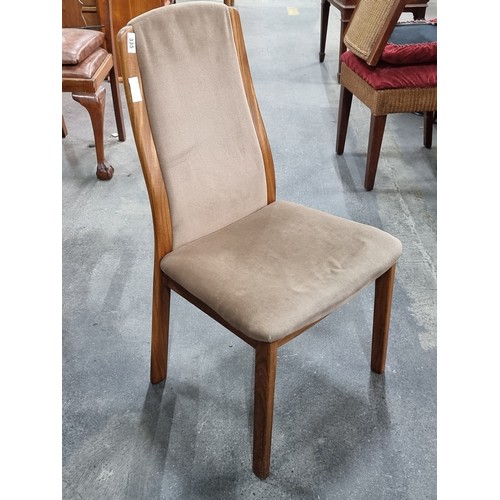 335 - A magnificent set of four mid century G Plan teak dining chairs. Upholstered with a caspian brown se... 