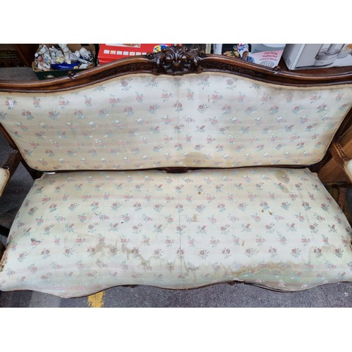 396 - Star Lot : A horse hair original Victorian three-seater sofa with intricate carved wooden detailing,... 